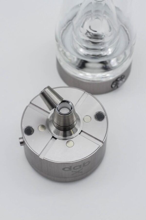 The dabX go unit opened to show the heating chamber and cap.